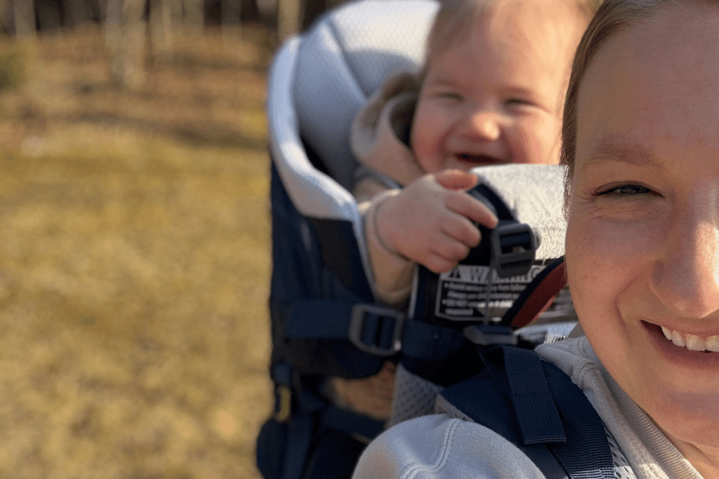 Child in hiking carrier, framed Deuter carrier