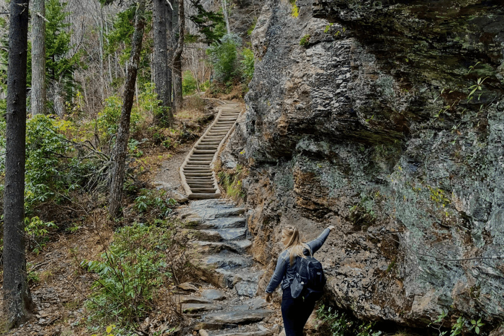 Woman Hiking up Rock Stairs in GSMNP Alum Cave Trail one of the best day hikes