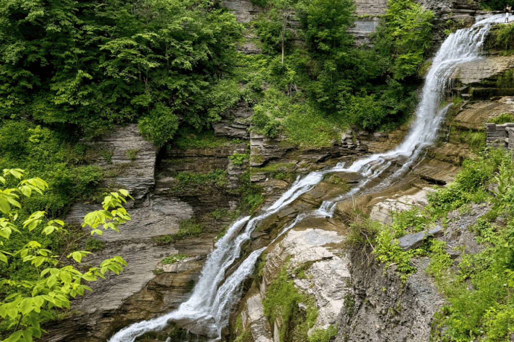 Lucifer Falls side view with a person for size reference. Near Finger Lakes NY