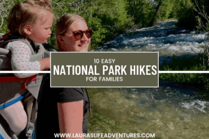 10 Easy Hikes in National Parks for Families Text over Mom and daughter hiking near a stream in grand teton national park